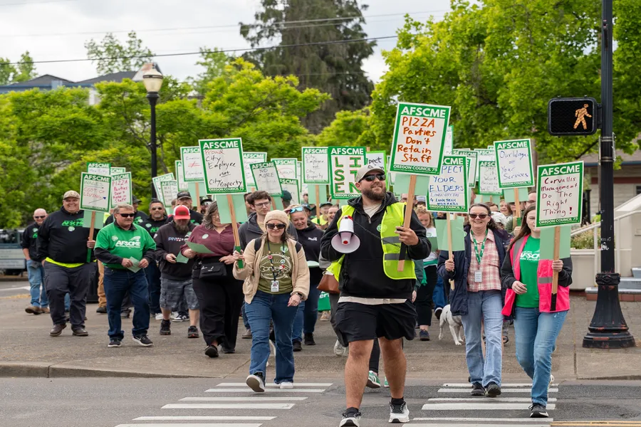 Members marching across a street